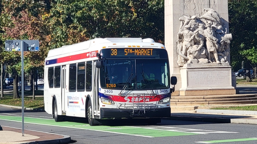 SEPTA bus route 38 driving through Philadelphia streets, highlighting accessible public transportation options.