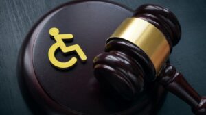 Disability Law: A judges hammer, next to a symbol of a wheelchair (the international symbol for disability).