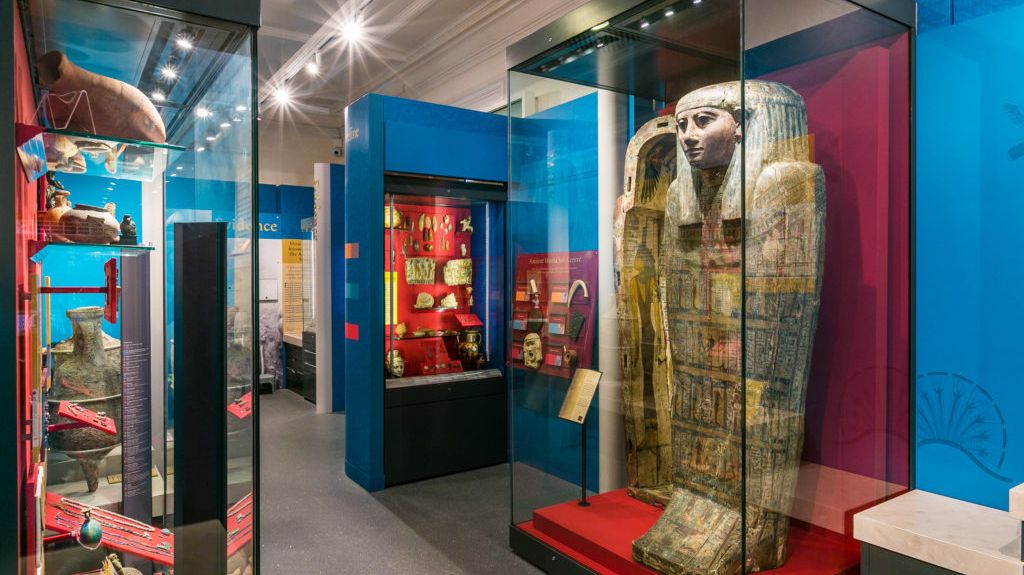 Museum interior showing ancient Egyption artifacts.