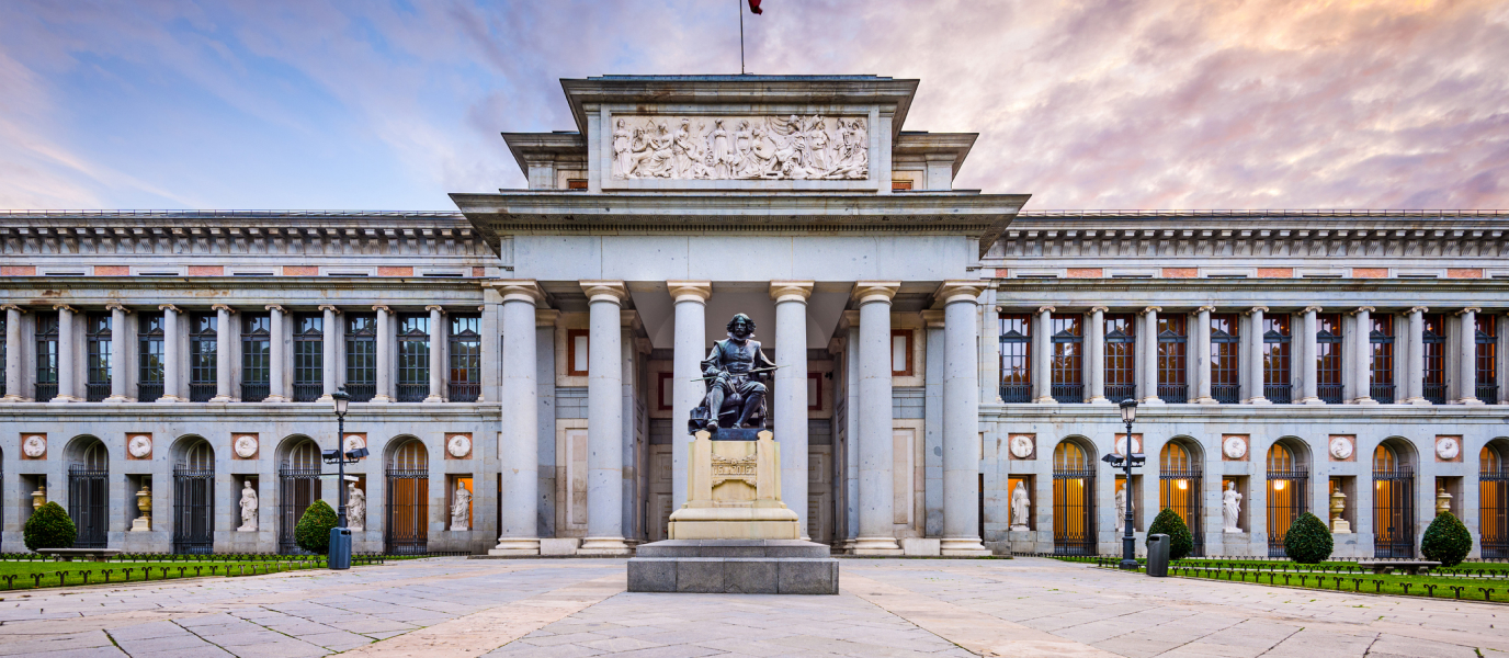 The Velázquez Entrance of the Prado Museum in Madrid with the statue of Diego Velázquez in front of the main colonnade