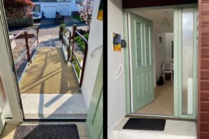 Step-free entrance at Seahorses accessible holiday bungalow in Brixham, with wide ramp, handrails, and level entry front door.