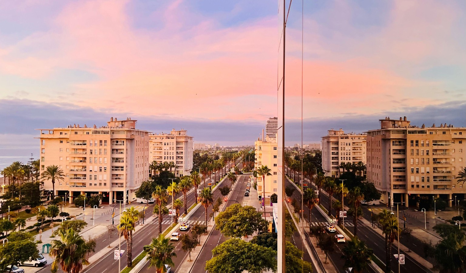 A pastel sunset over South Padre Island, Texas, showing palm-lined boulevards, modern beachfront condominiums, and calm evening skies — a tranquil view of one of the most wheelchair accessible beach destinations in the USA.
