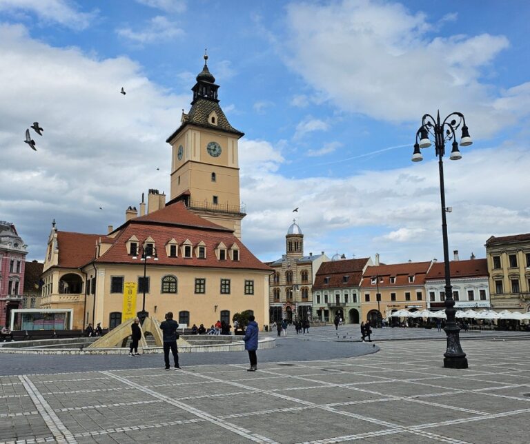 Brașov Council Square, Piața Sfatului, with the historic Council House tower and wide open paved square, Transylvania Romania