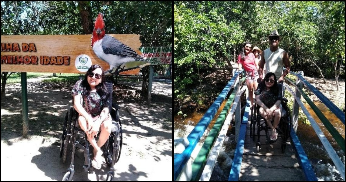 A woman in a wheelchair poses next to a wooden "Ilha da Melhor Idade" sign featuring a bird, followed by a shot of her being assisted across a blue and white wooden bridge over the river.