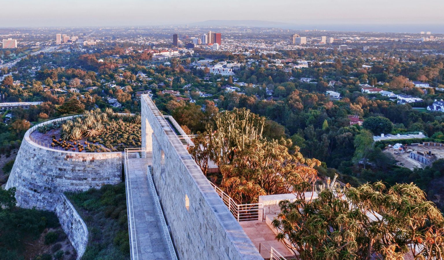 Aerial view of the Getty Center's accessible terraced walkways and cactus gardens overlooking the Los Angeles cityscape – accessible guide to LA