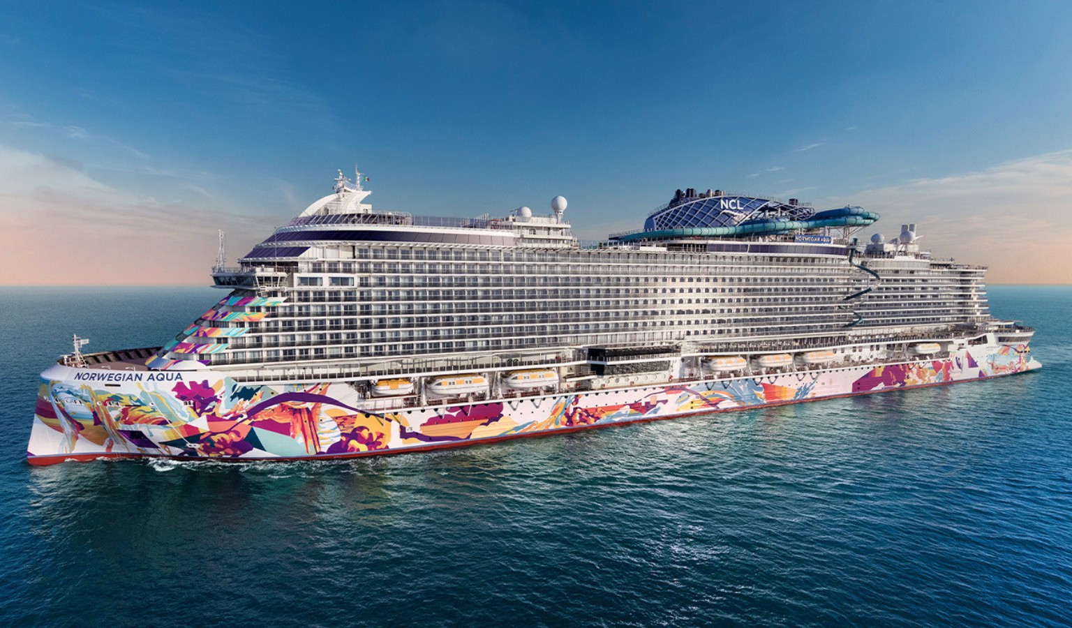 An image of the Norwegian Aqua Cruise Ship sailing on the ocean. This article takes a look at their accessible cabins.