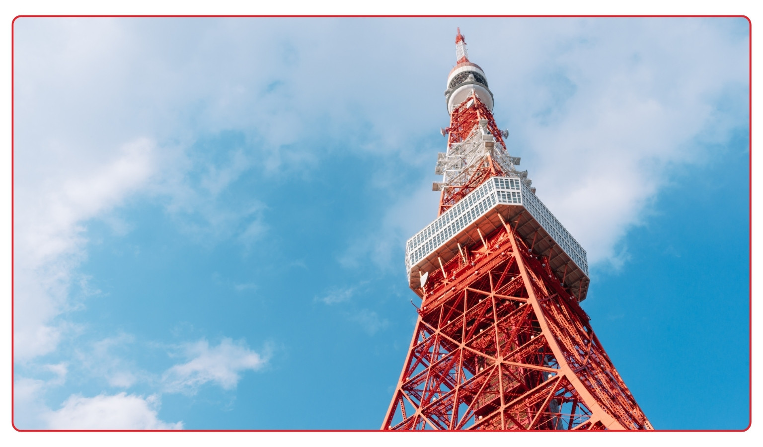 Tokyo Tower in Minato viewed from below against a blue sky, showing its red and white lattice structure and main observation deck